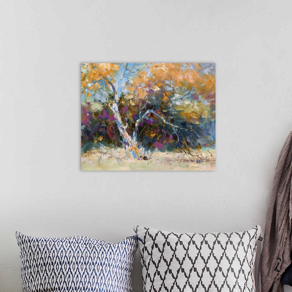 A bohemian room featuring Contemporary vibrant landscape painting of an autumn foliage tree.