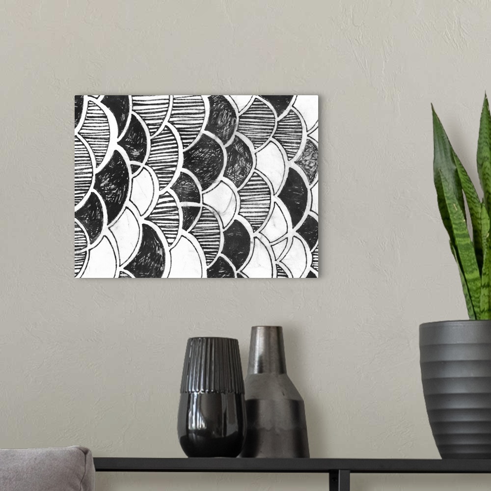 A modern room featuring Black and white drawing of patterned scales.