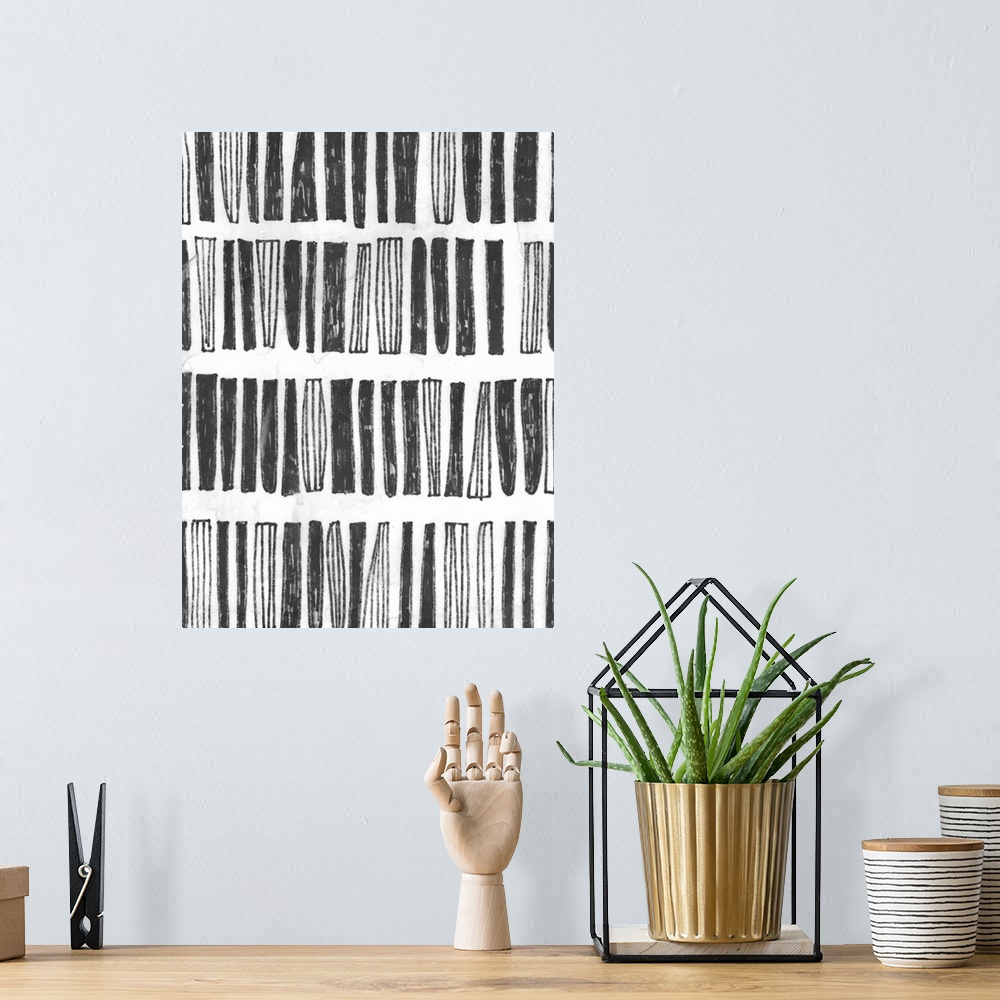 A bohemian room featuring Black and white drawing of striped and solid vertical blocks.