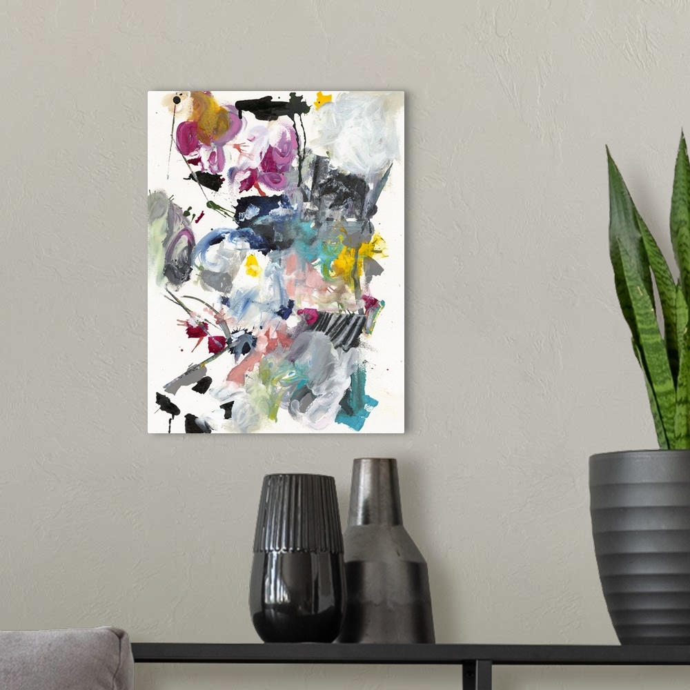 A modern room featuring Abstract painting in wild splashes and splatters of pink, teal, yellow, and black.
