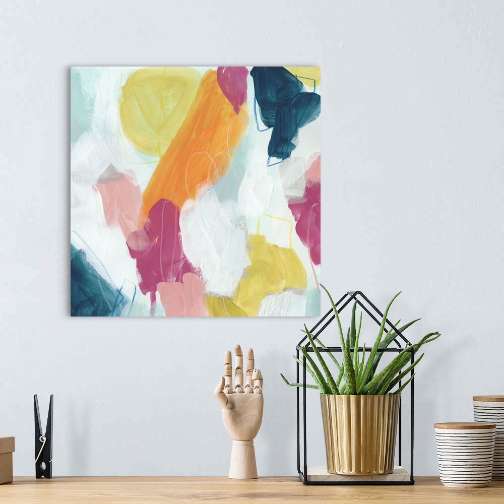 A bohemian room featuring Abstract contemporary artwork with bright pink and yellow against deep blue.