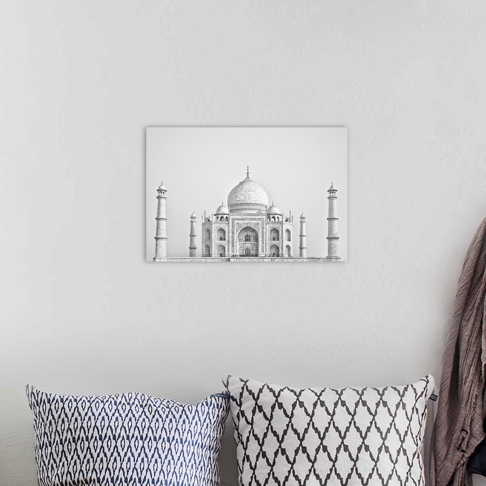 A bohemian room featuring Black and white photo of the Taj Mahal in Agra, India.
