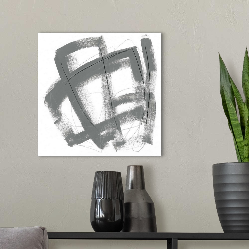 A modern room featuring Contemporary abstract painting using bold gray contrasting against a stark white background.