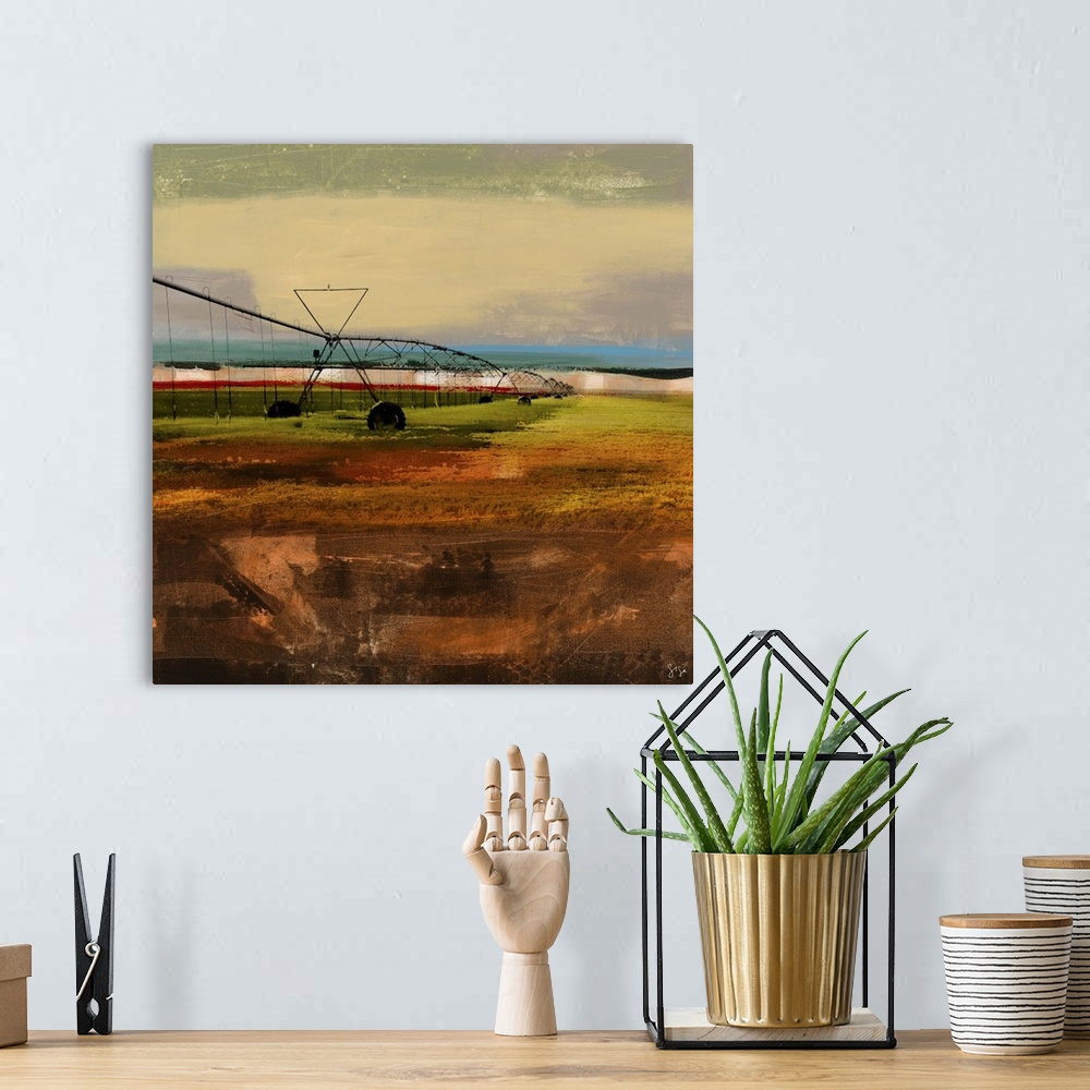 A bohemian room featuring Abstract artwork of farming watering device against a multi-layered and colored surrounding.
