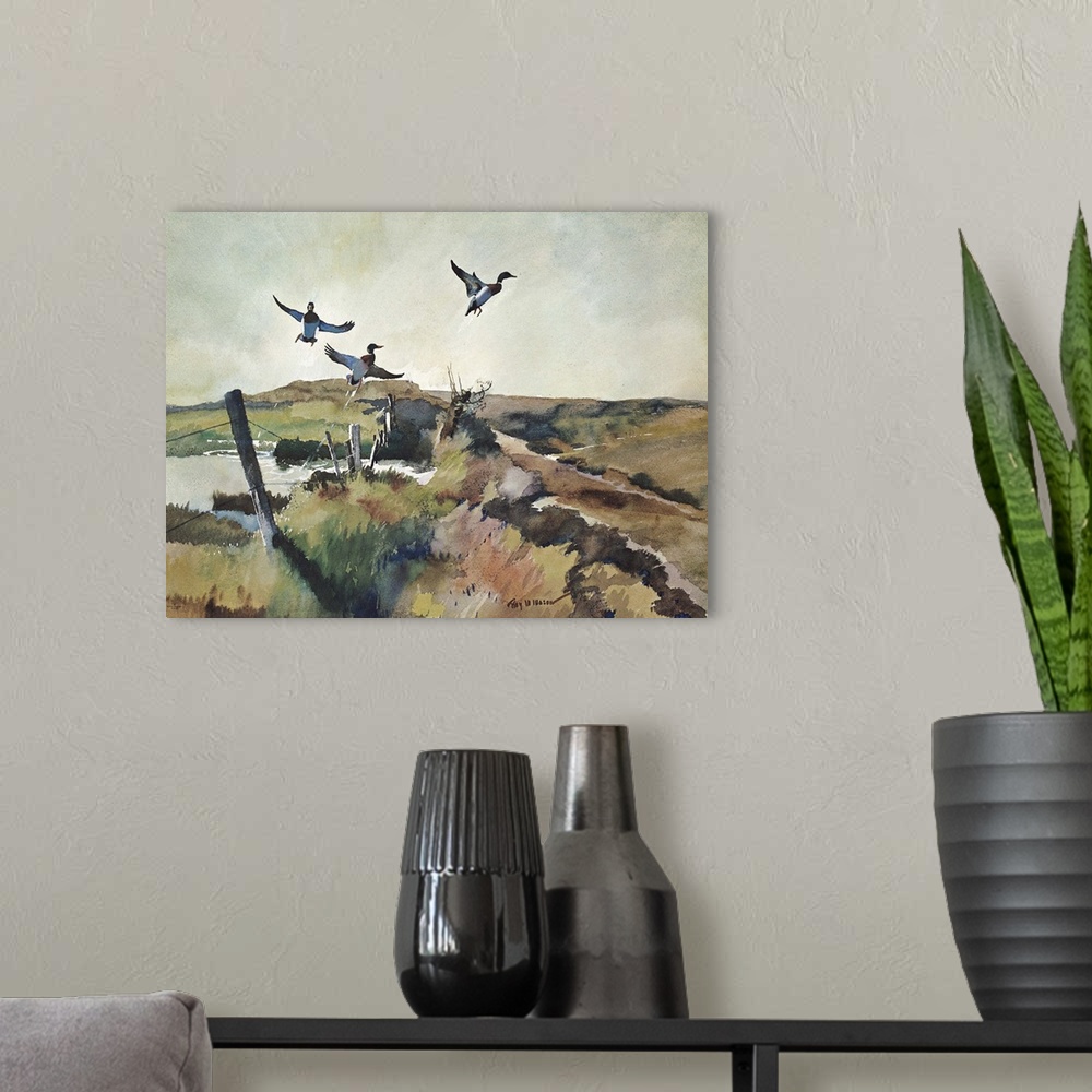 A modern room featuring Contemporary watercolor painting of birds taking off into flight.
