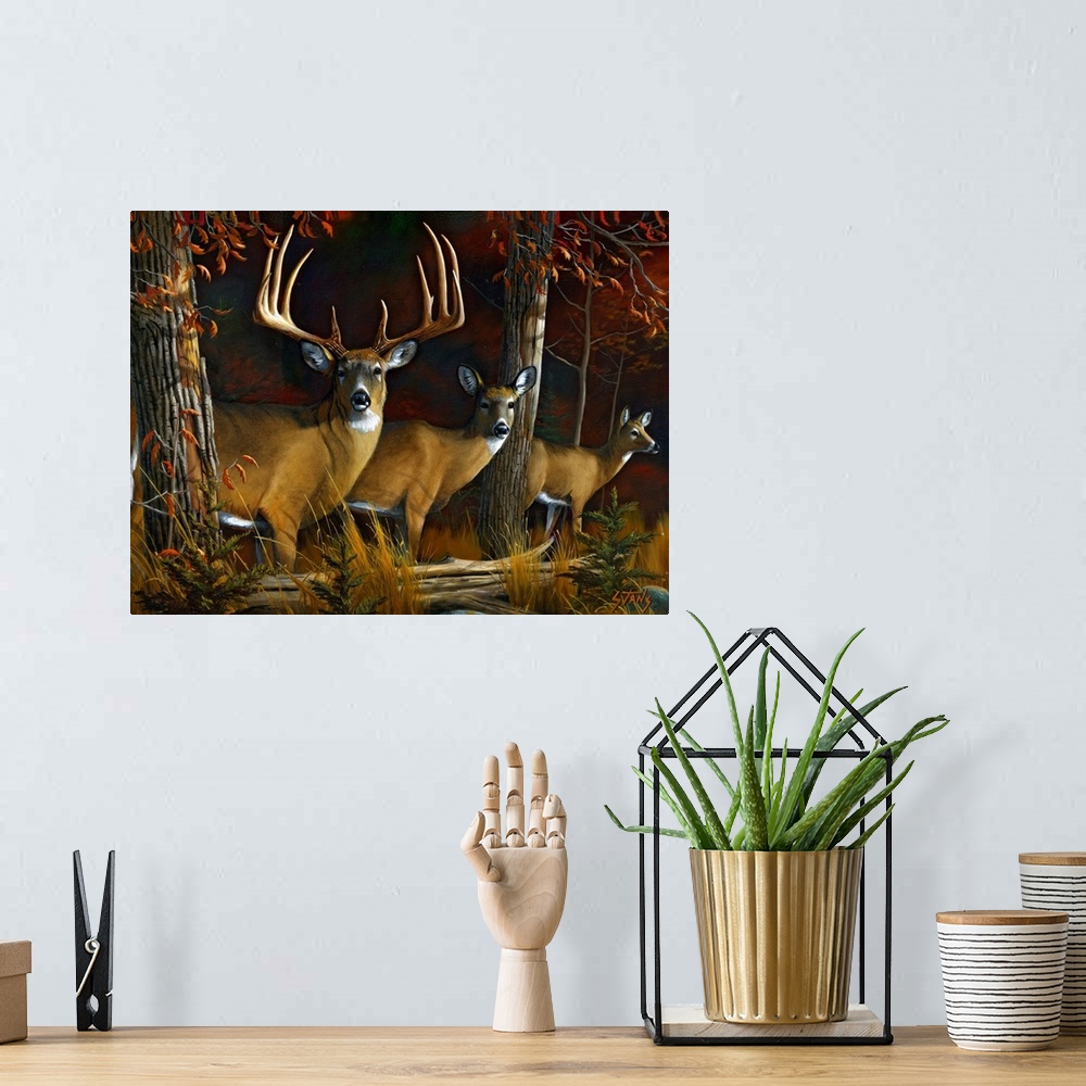 A bohemian room featuring Painting of three deer in forest with fallen tree log in front of them.