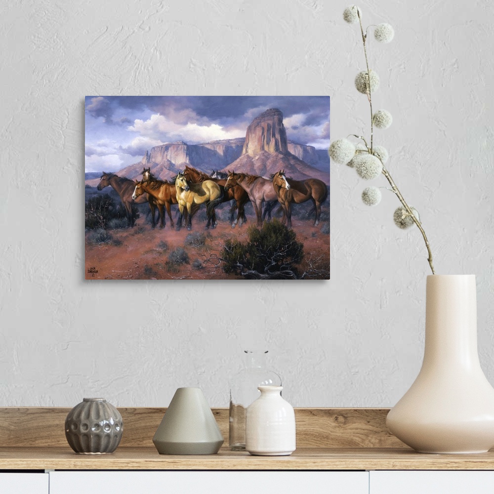 A farmhouse room featuring Contemporary Western artwork of a herd of wild horses in a canyon standing alert and still.