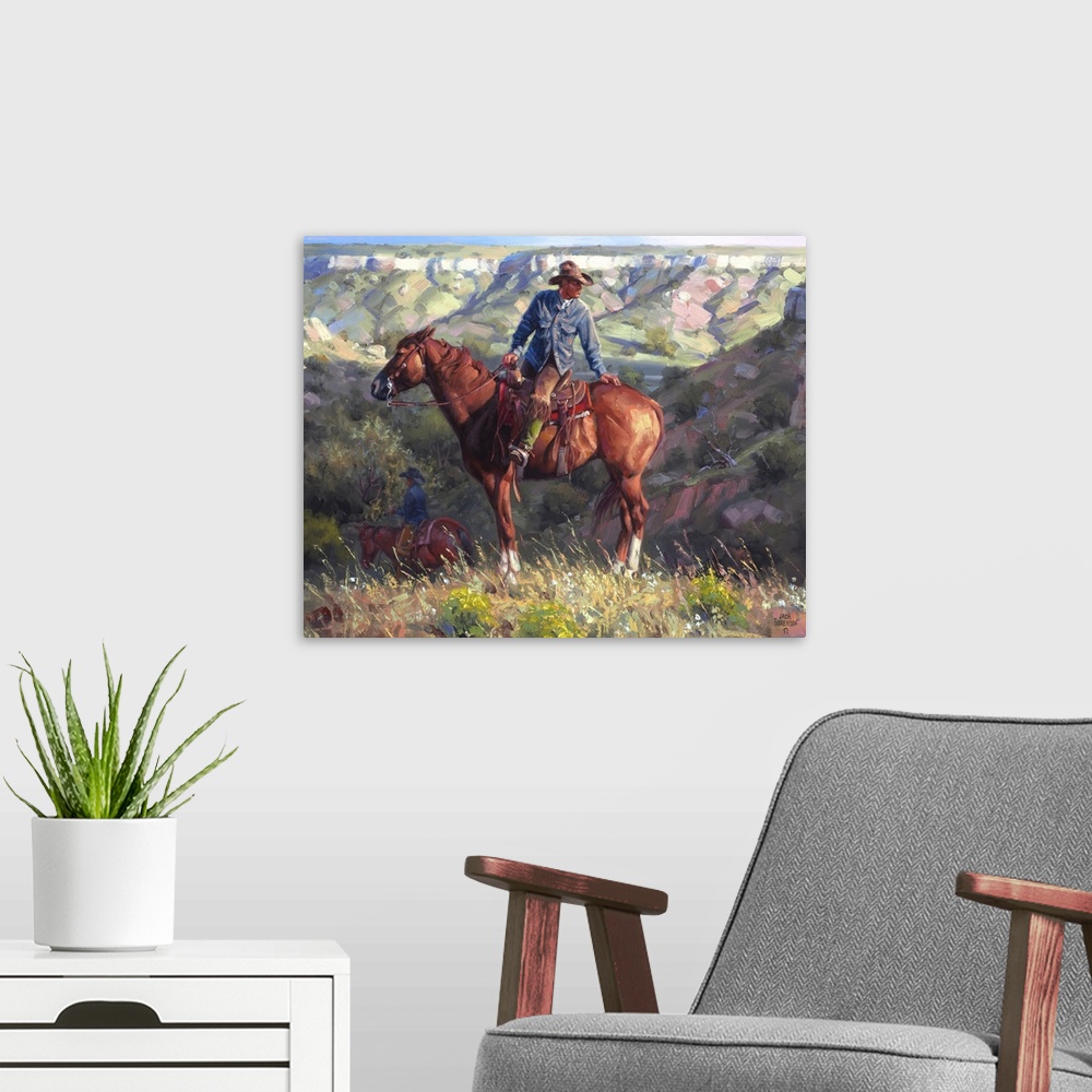 A modern room featuring Contemporary painting of a cowboy on a chestnut horse overlooking a western valley landscape.