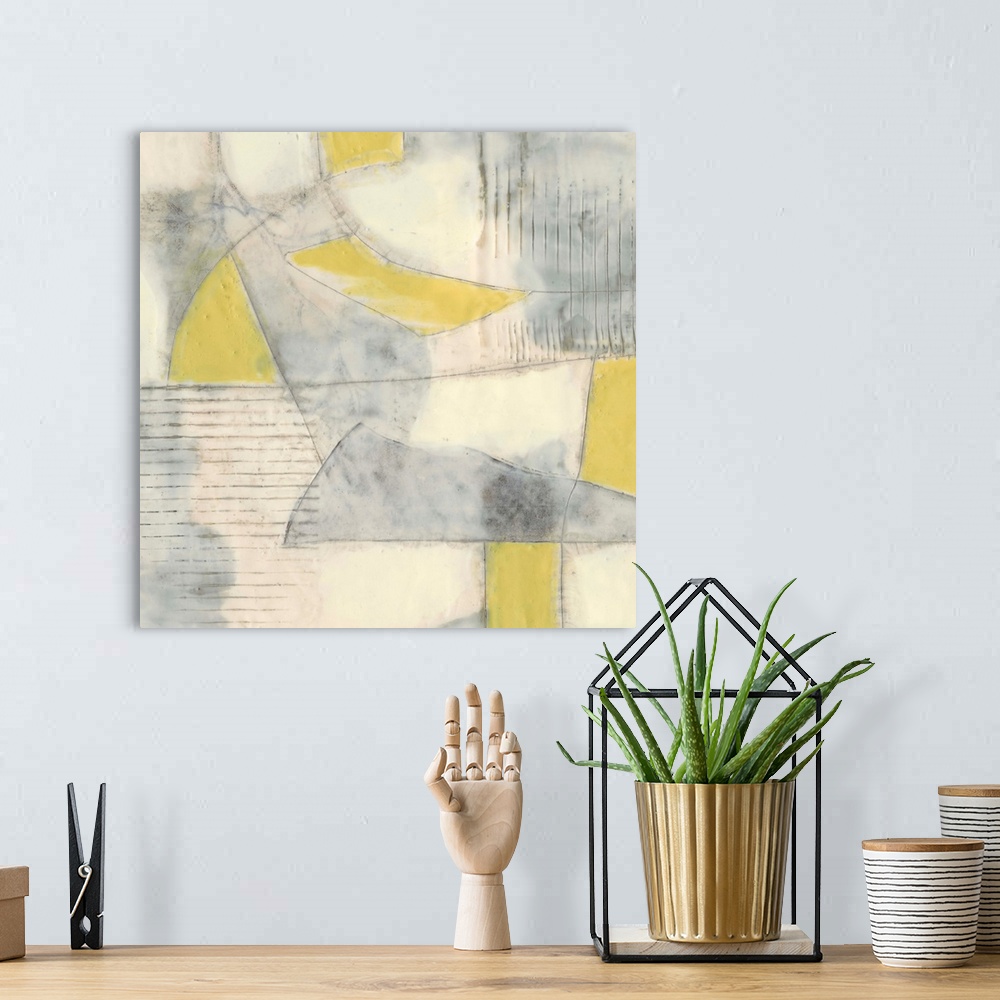 A bohemian room featuring Contemporary abstract painting using pale yellows and gray in geometric shapes.