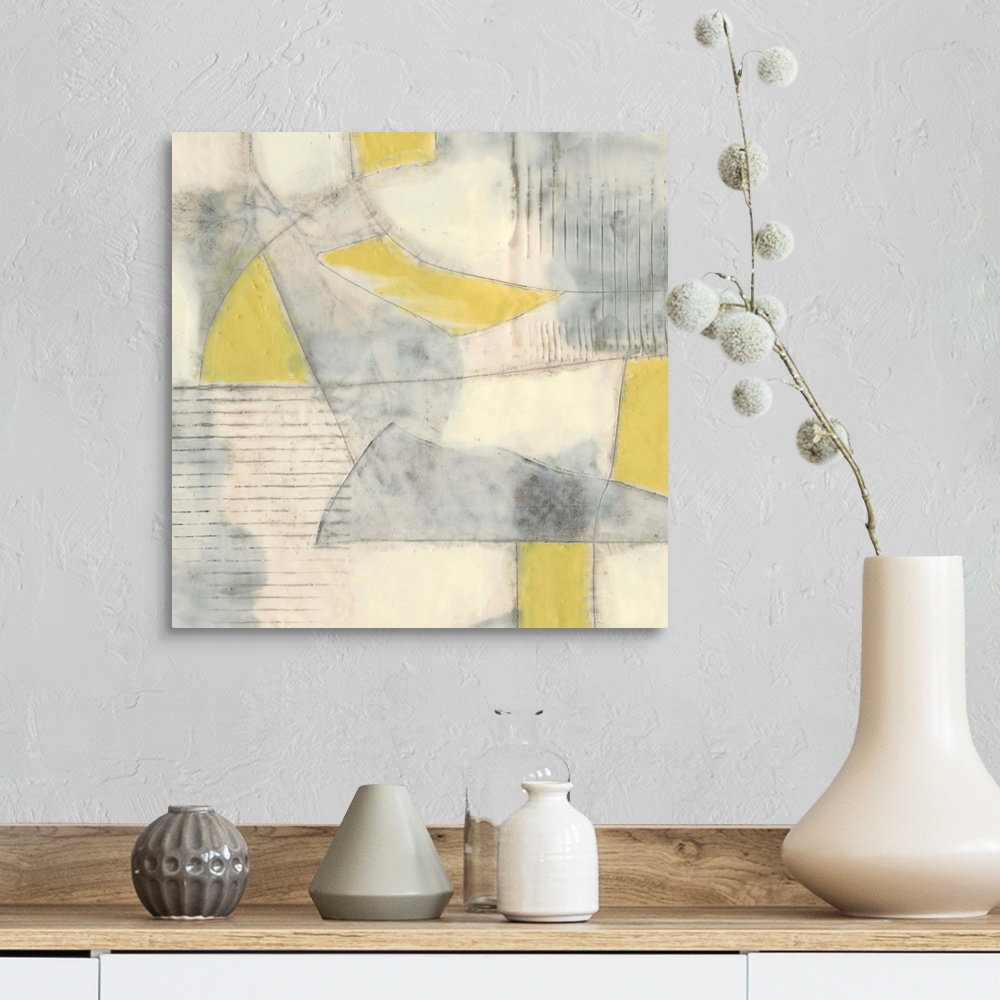 A farmhouse room featuring Contemporary abstract painting using pale yellows and gray in geometric shapes.