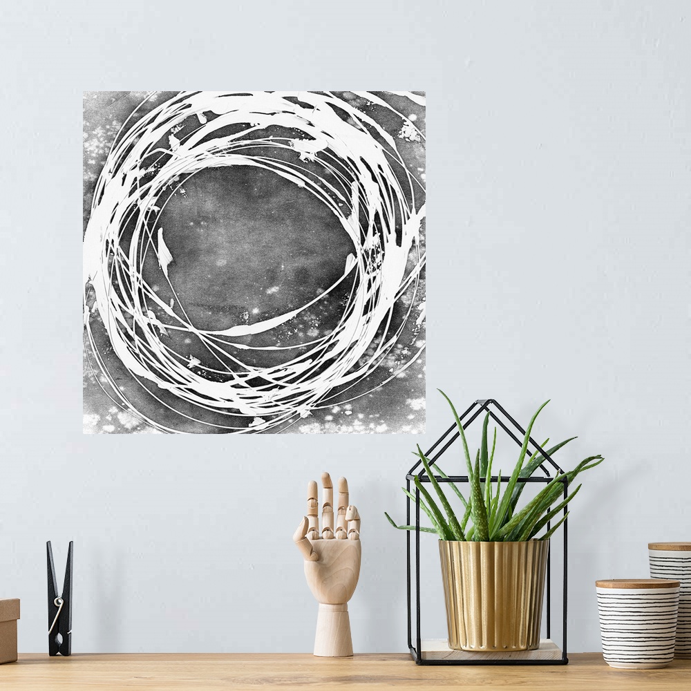 A bohemian room featuring Abstract painting in grey with a white circular shape.