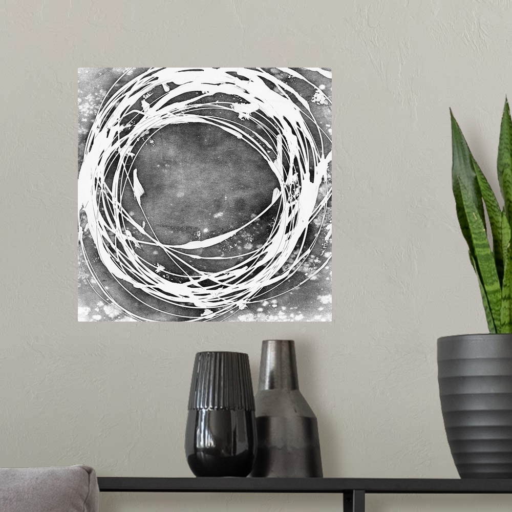 A modern room featuring Abstract painting in grey with a white circular shape.