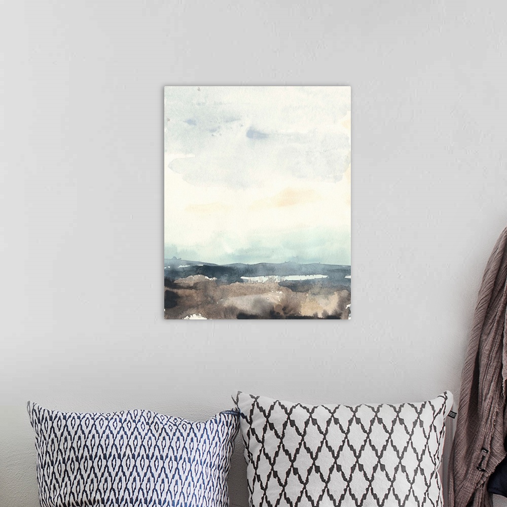 A bohemian room featuring Watercolor seascape painting with a bright sky.