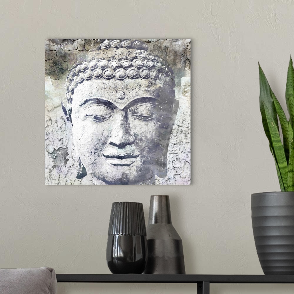 A modern room featuring Close up photo of the face of a sculpture of Buddha, showing his downcast eyes and tight curls in...