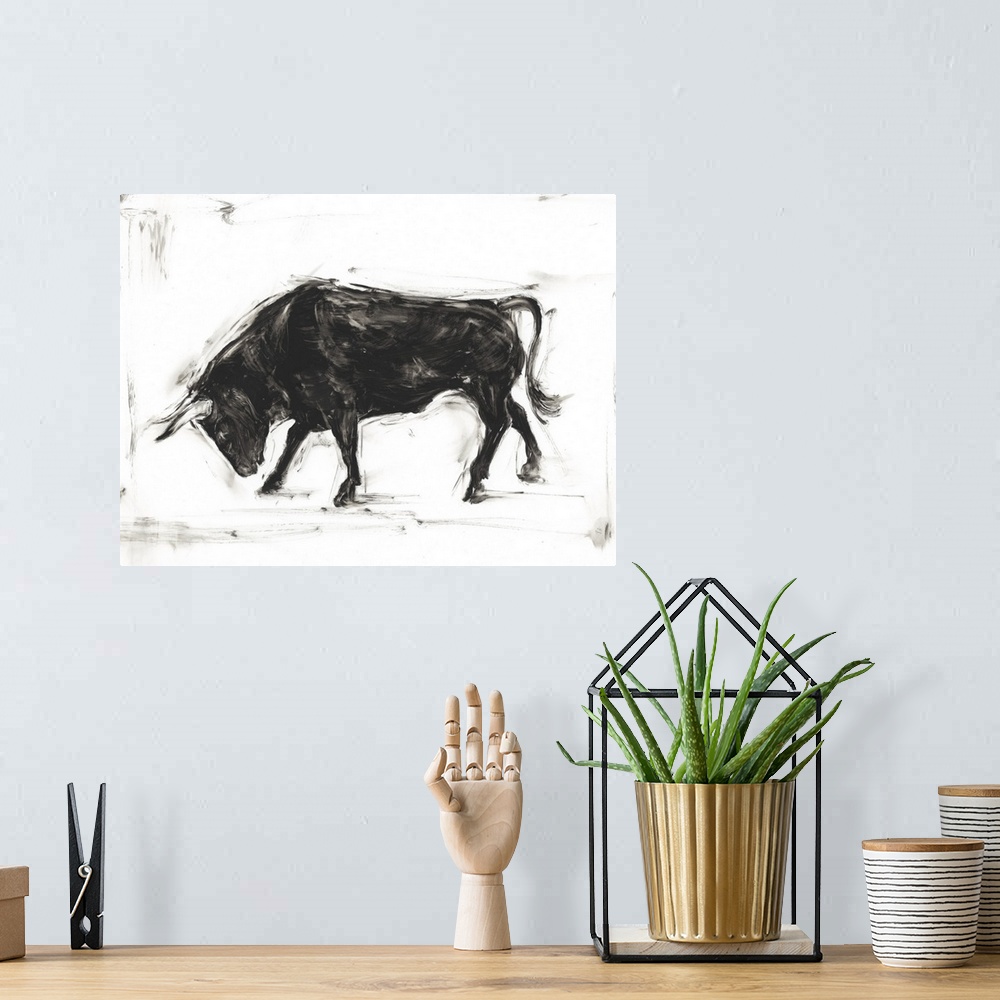A bohemian room featuring Black and white painting of a Spanish bull bowing.