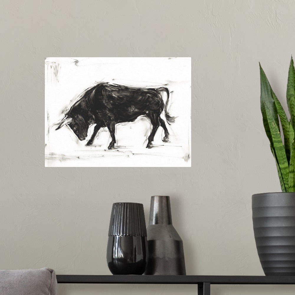A modern room featuring Black and white painting of a Spanish bull bowing.