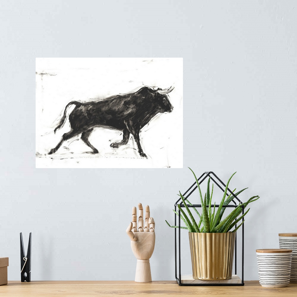 A bohemian room featuring Black and white painting of a Spanish bull in action.