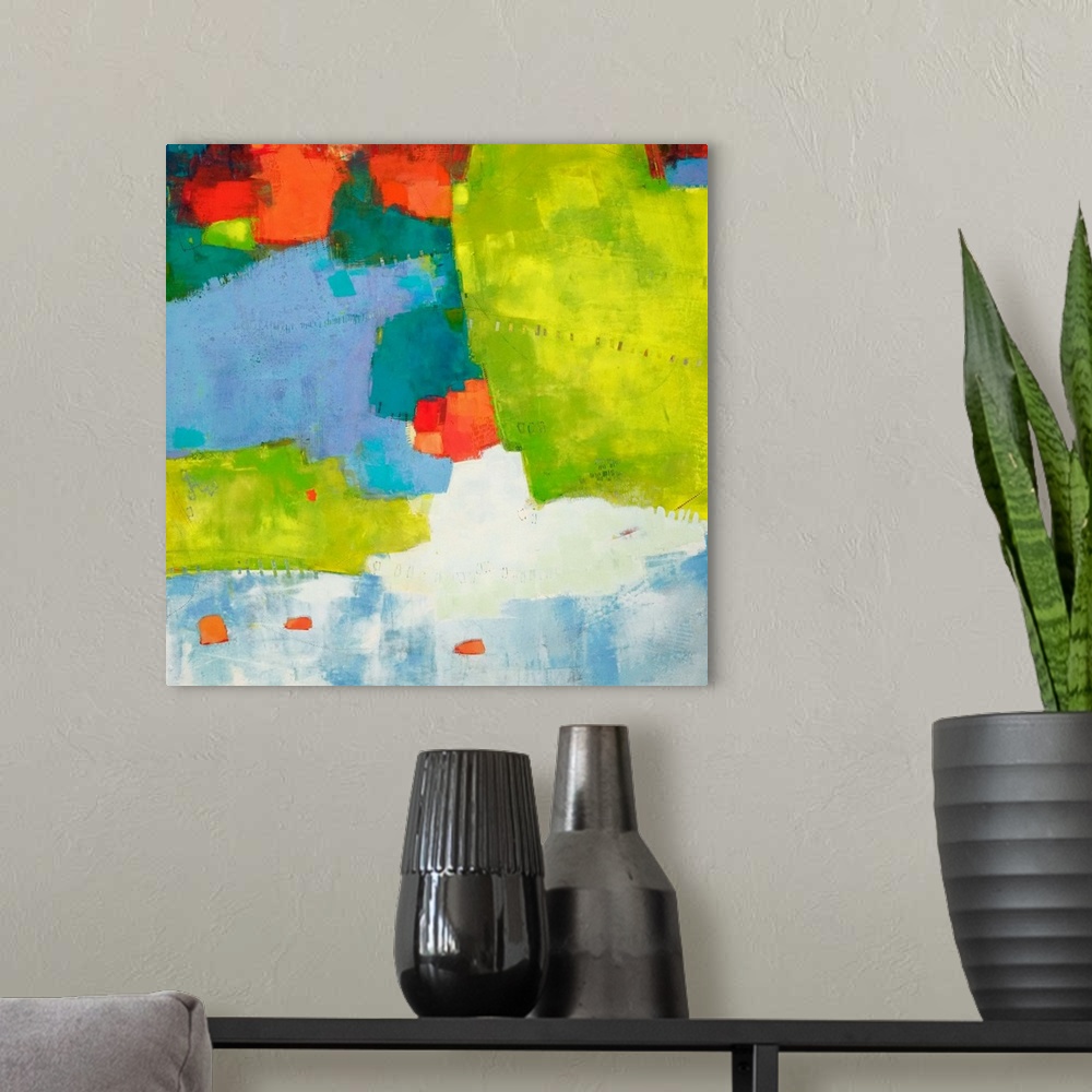 A modern room featuring Abstract contemporary art in tropical lime green, blue, and bright orange.