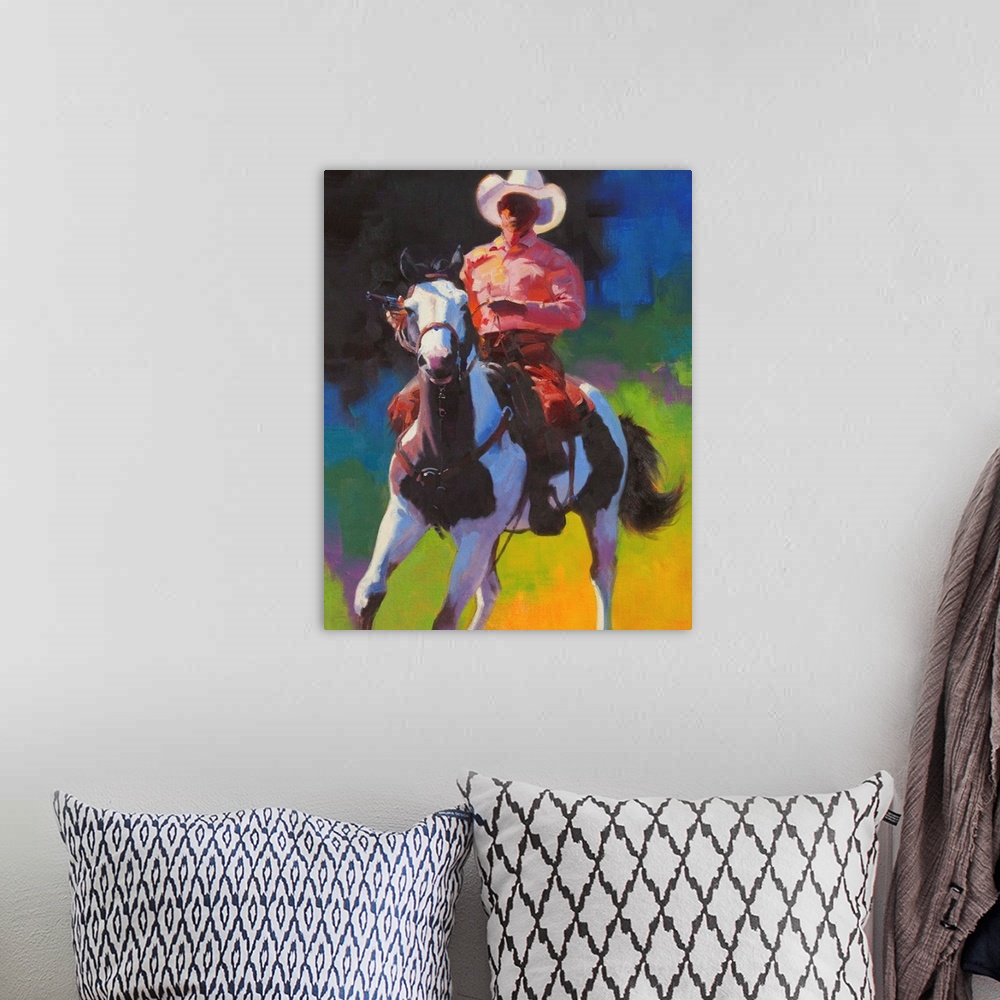 A bohemian room featuring Contemporary painting of a cowboy atop of a brown and white paint horse.