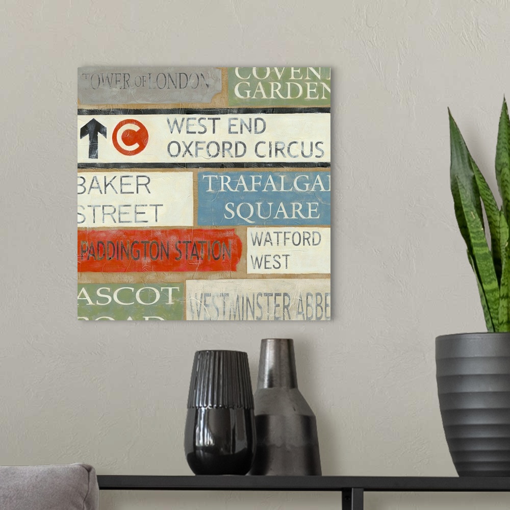 A modern room featuring Artwork of street signs arranged in a collage type pattern.  Some of signs are for Watford West, ...