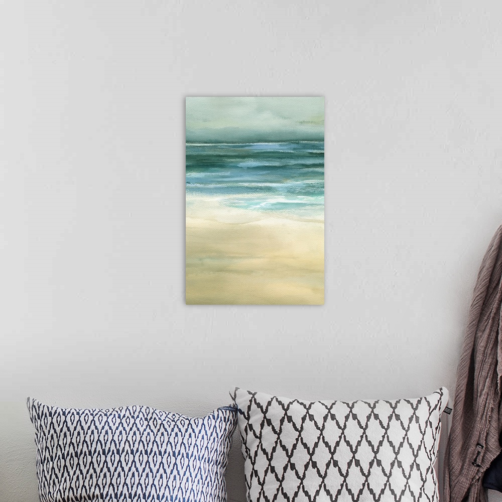 A bohemian room featuring Beautiful artwork of a seascape that uses duller colors to paint the ocean and sand.