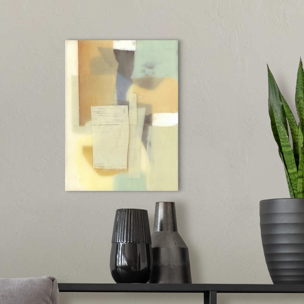 A modern room featuring Muted contemporary painting in yellow and grey, with soft, blurred edges.