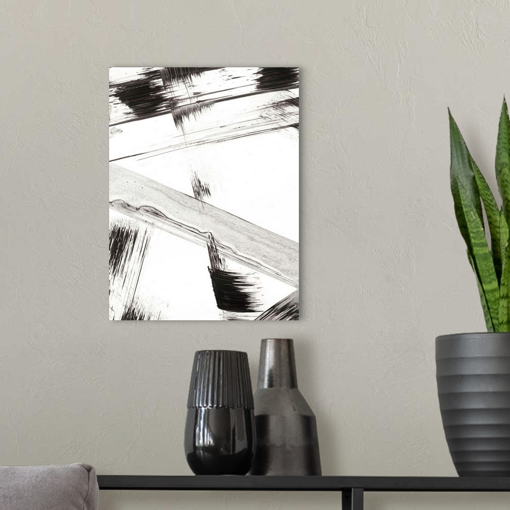 A modern room featuring Contemporary abstract painting of black and gray brushstrokes on a white background.