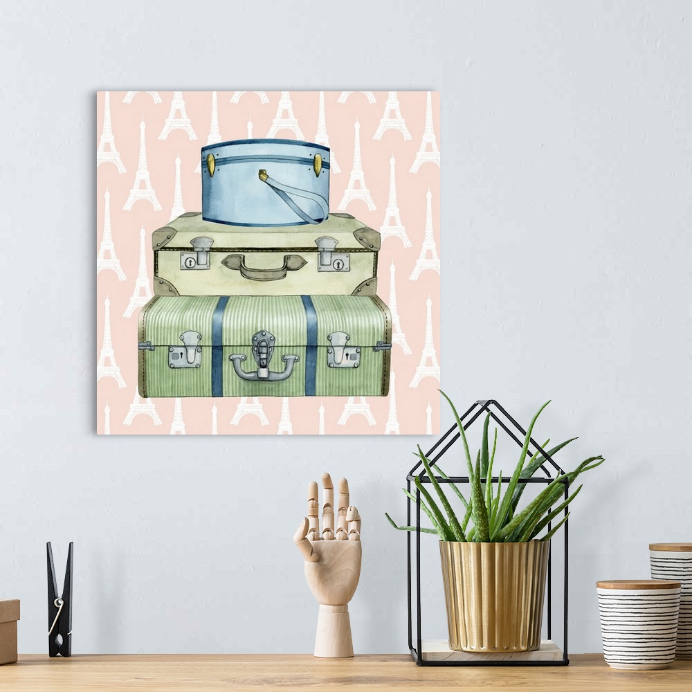 A bohemian room featuring Art print of three vintage suitcases on a pastel pink background with an Eiffel Tower pattern.