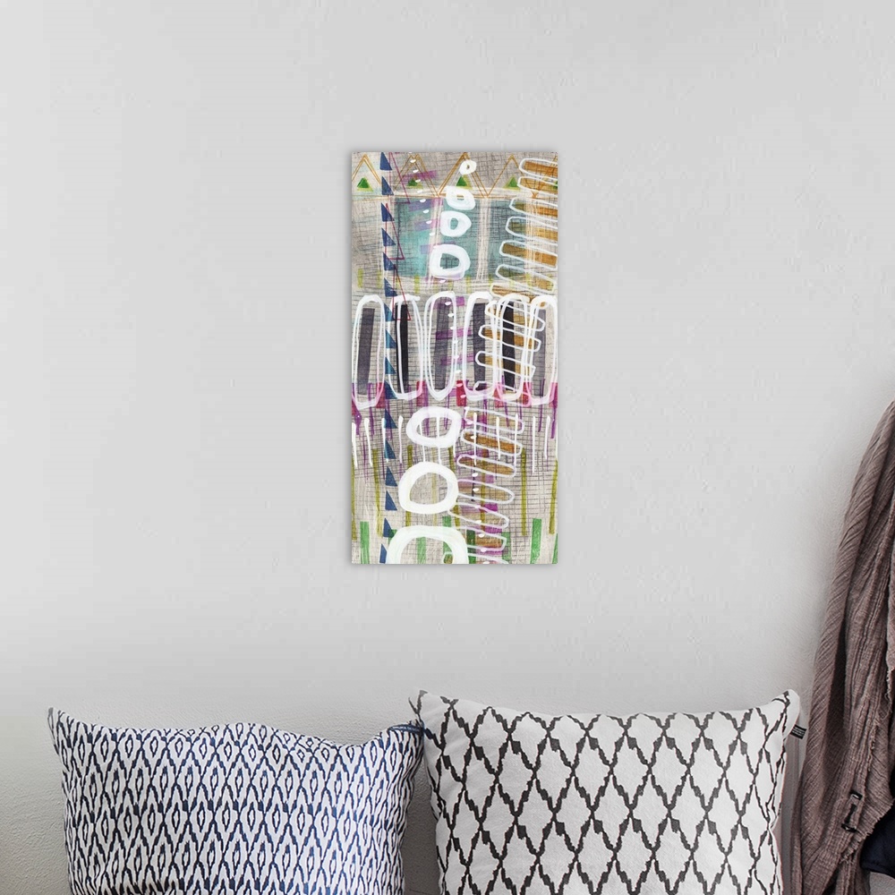 A bohemian room featuring Large panel abstract painting with colorful tribal designs and geometric shapes layered.