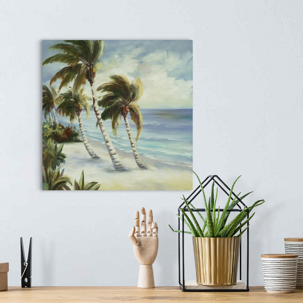A bohemian room featuring Contemporary artwork of leafy palm trees bending over the ocean on the beach.