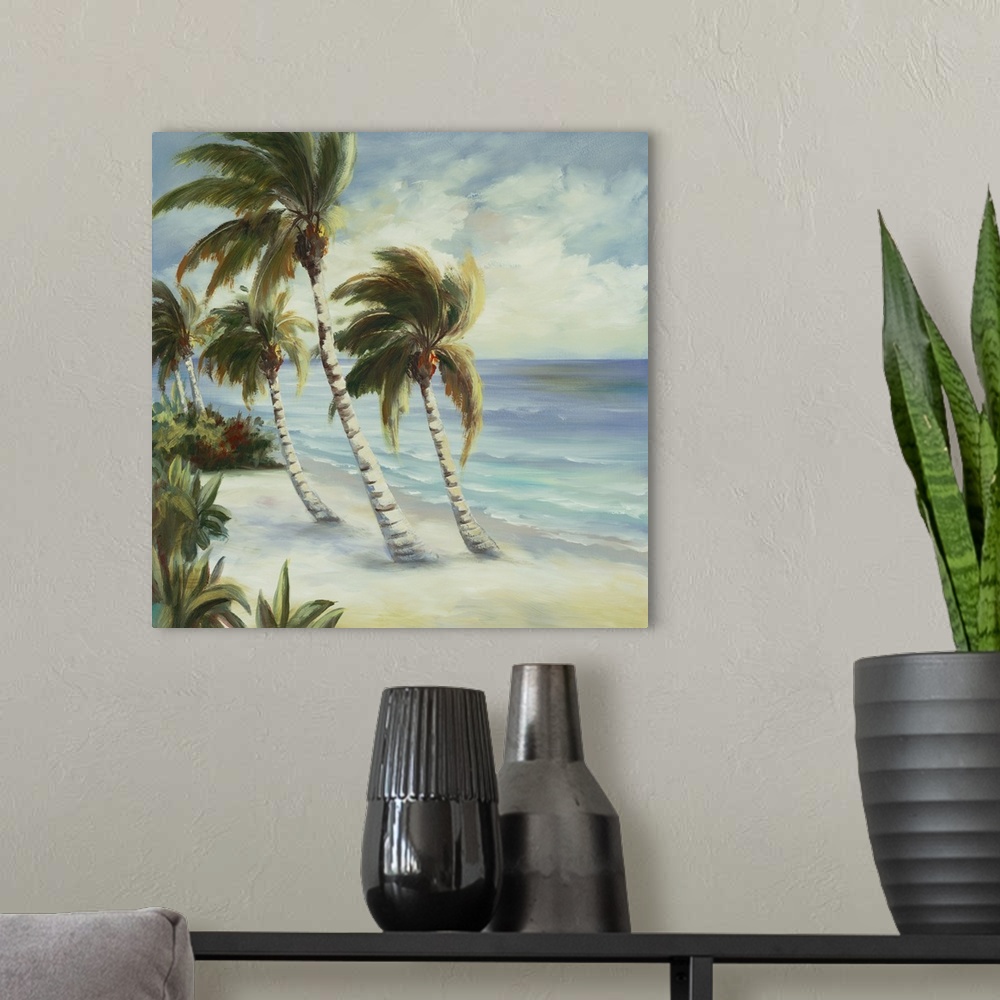 A modern room featuring Contemporary artwork of leafy palm trees bending over the ocean on the beach.