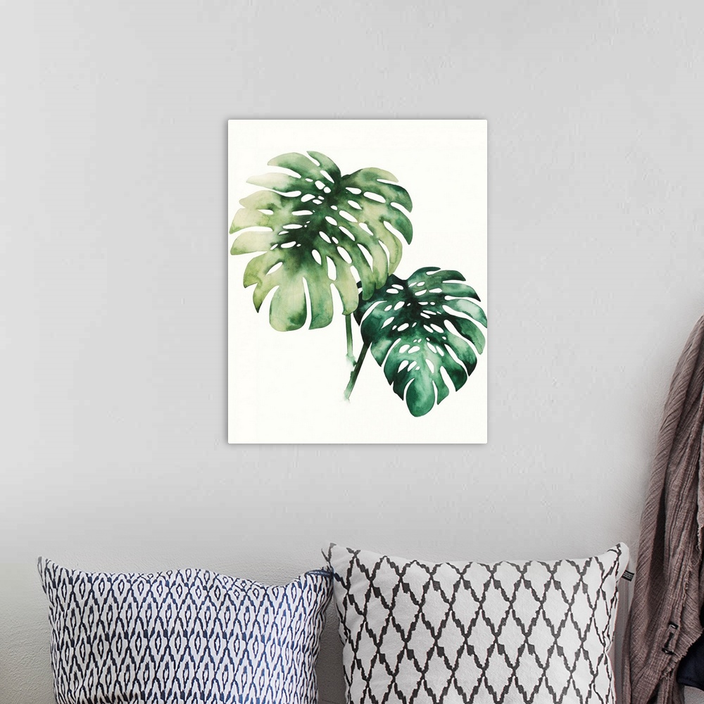 A bohemian room featuring Watercolor artwork of two broad green palm fronds.