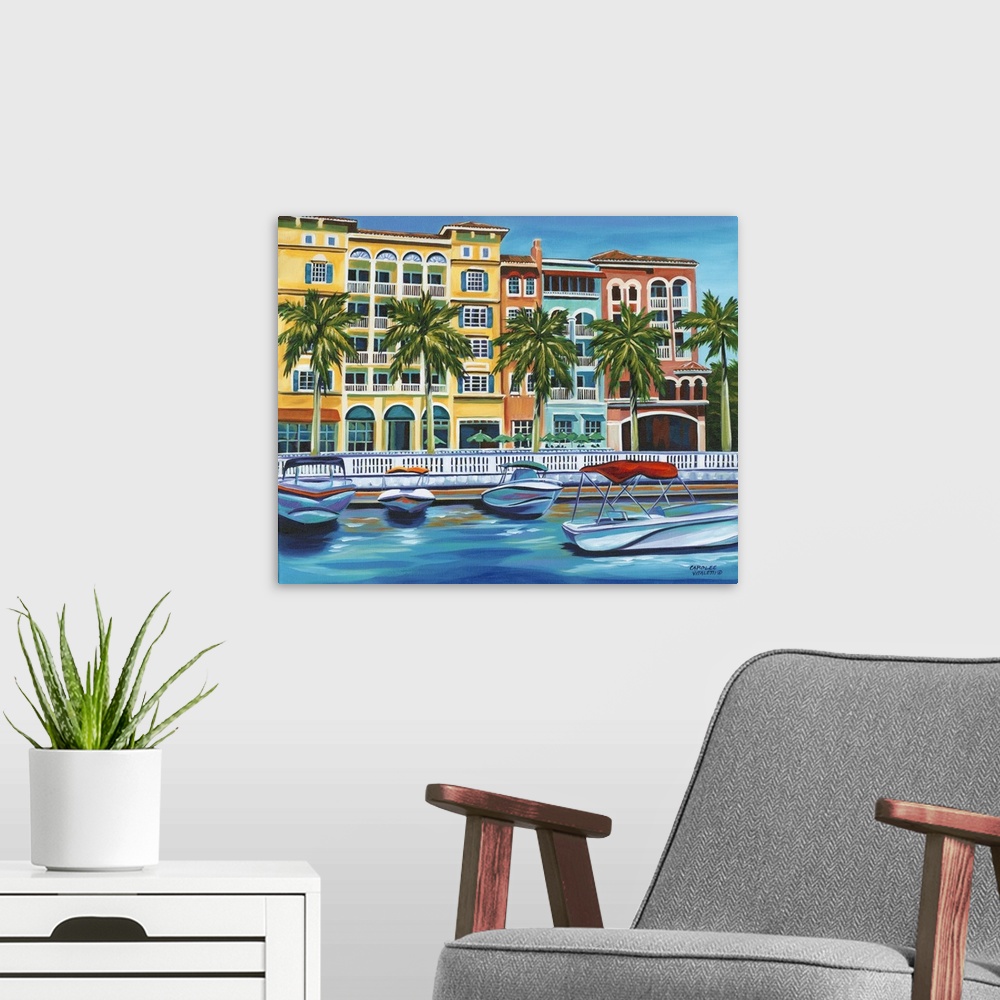 A modern room featuring Contemporary artwork of a riverside resort with several boats at the dock.