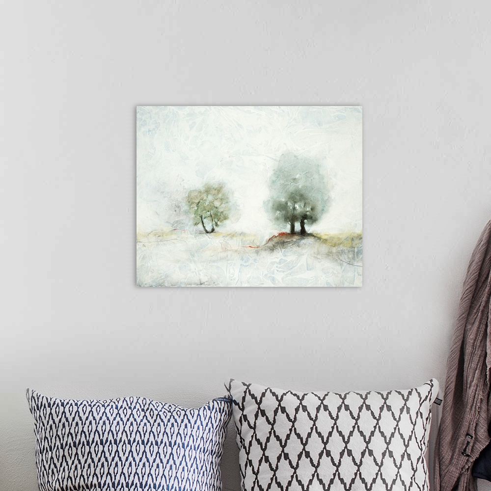 A bohemian room featuring Pastel landscape painting of two trees in the misty countryside.