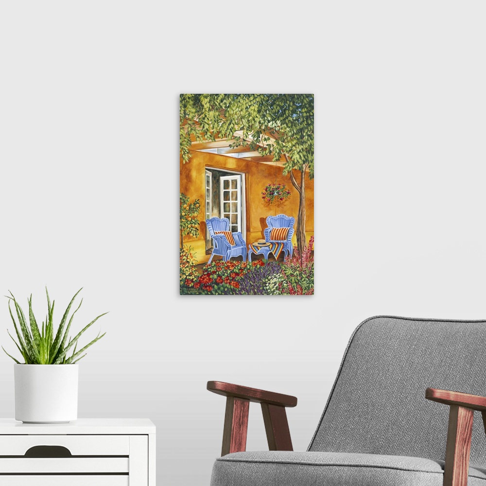 A modern room featuring Contemporary painting of a Mediterranean patio with two comfortable chairs and a shady tree.