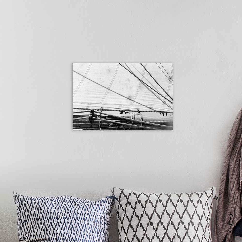 A bohemian room featuring Black and white photograph of details of a sailboat.