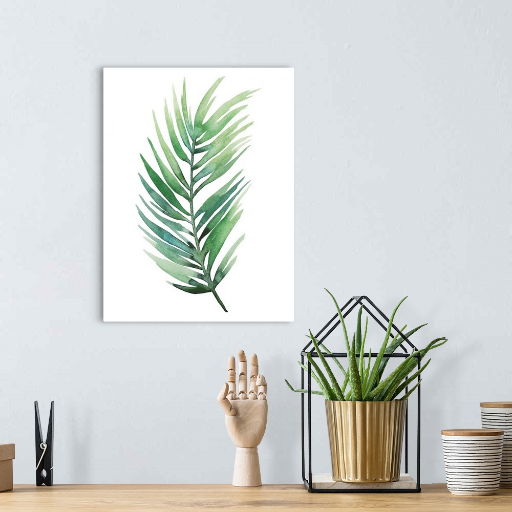 A bohemian room featuring Watercolor artwork of a leafy green palm frond on white.