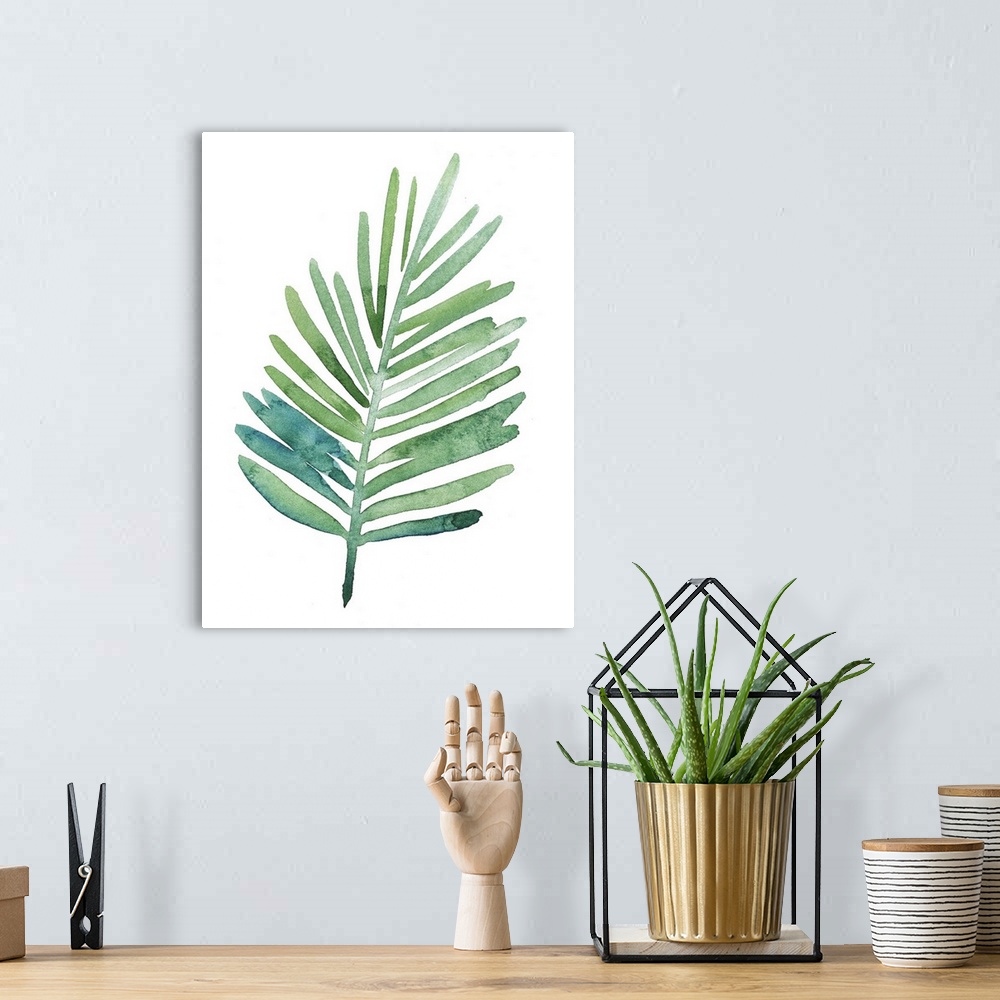 A bohemian room featuring Watercolor artwork of a leafy green palm frond on white.
