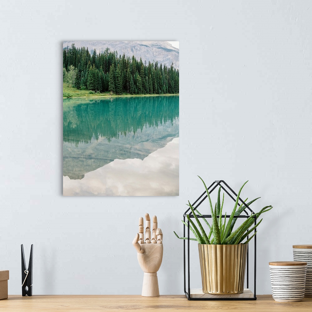 A bohemian room featuring Photograph of mountains reflected in the glassy surface of Moraine Lake, Emerald Lake Lodge, Banf...