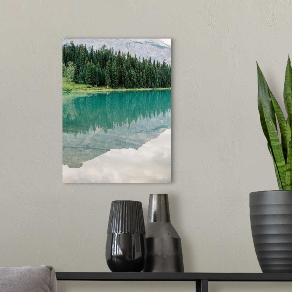 A modern room featuring Photograph of mountains reflected in the glassy surface of Moraine Lake, Emerald Lake Lodge, Banf...