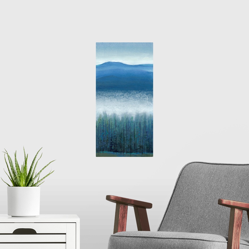 A modern room featuring Vertical painting of a mountain valley with dense fog over pine trees.