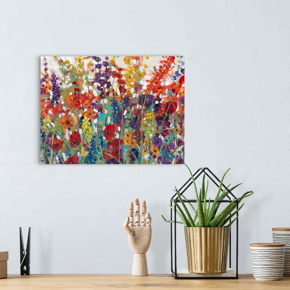 A bohemian room featuring This decorative artwork features sprouting bright wildflowers made from whimsical brush strokes w...