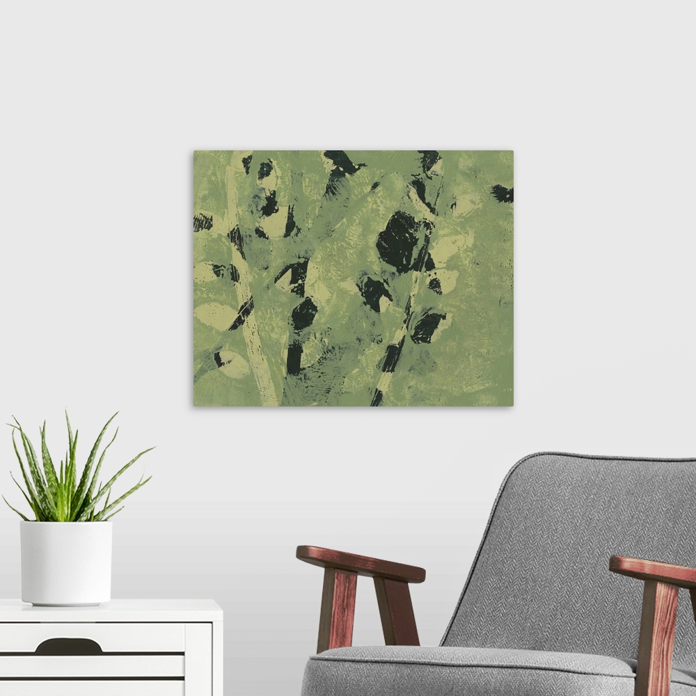 A modern room featuring Abstract image of shapes similar to leaves on a branch in merging colors of green and black.