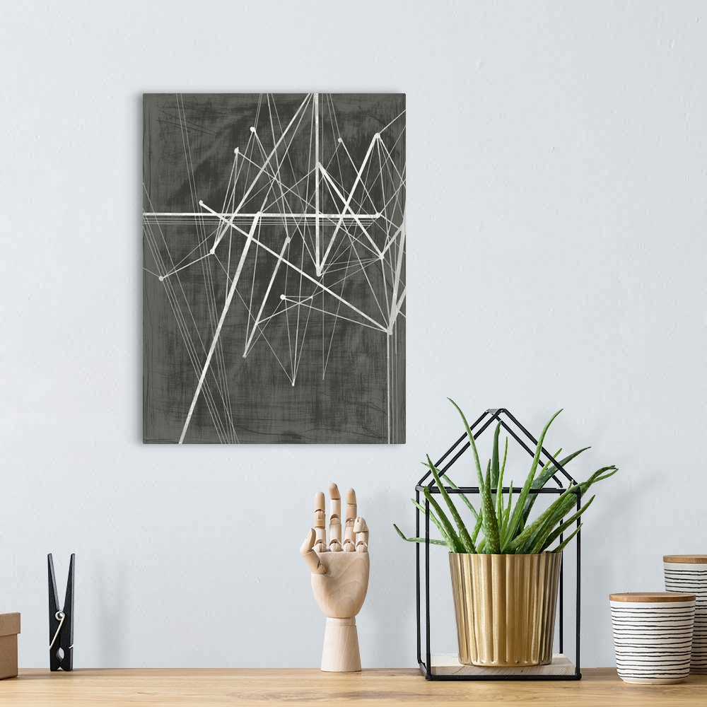 A bohemian room featuring Abstract painting made of several jagged lines on a dark background.