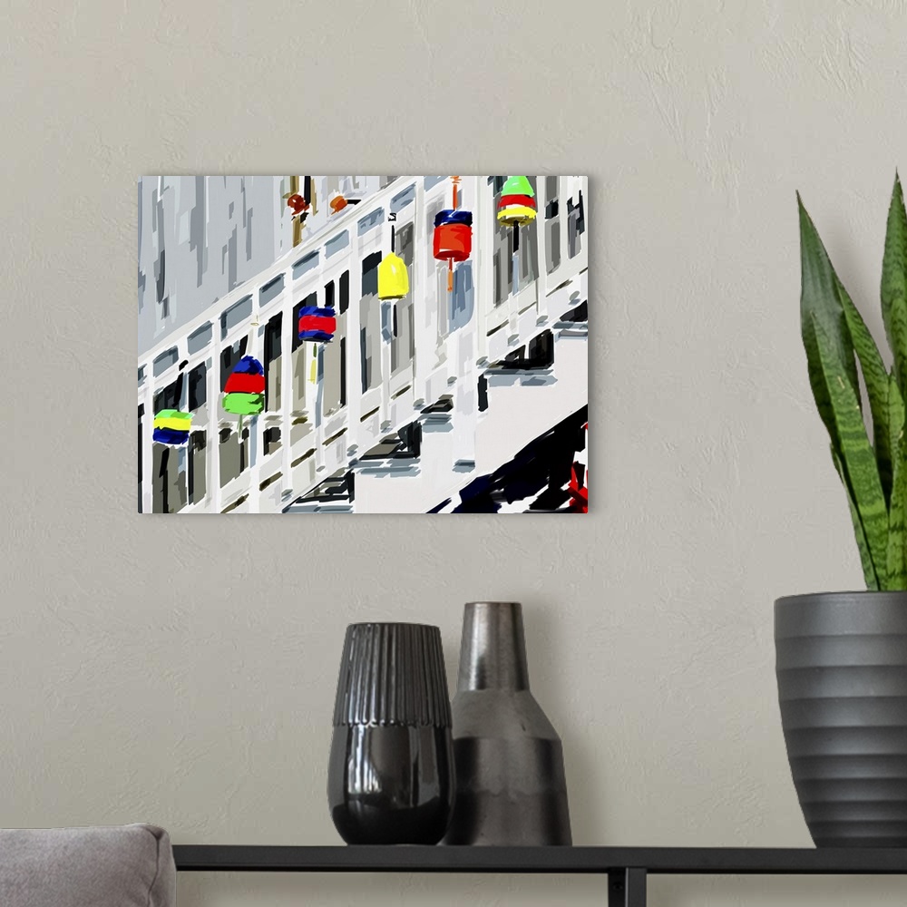A modern room featuring A colorful collection of lobster fishing buoys on the railing of a staircase.