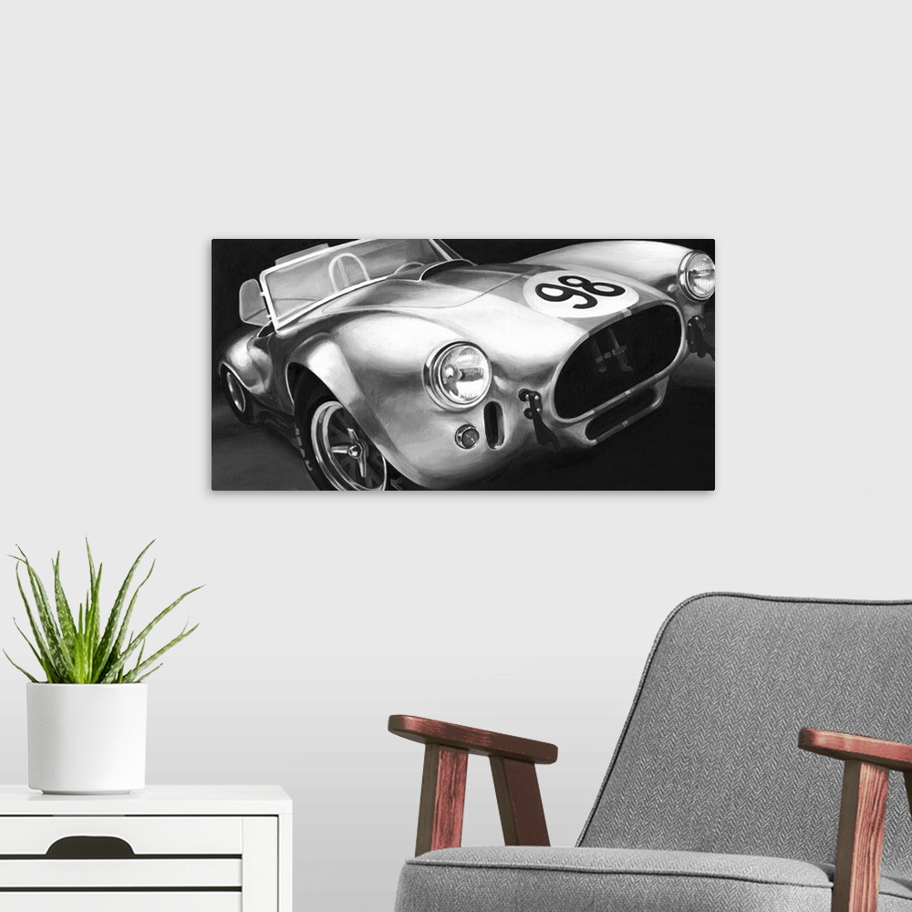 A modern room featuring Photograph of classic muscle car with a convertible top and a 98 emblem circle on the hood.