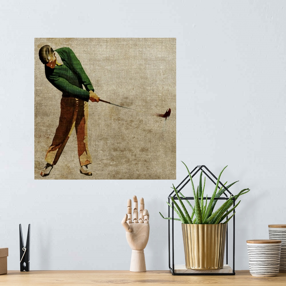 A bohemian room featuring Square, large, vintage wall picture of a man in slacks and a cardigan swinging a golf club, on a ...