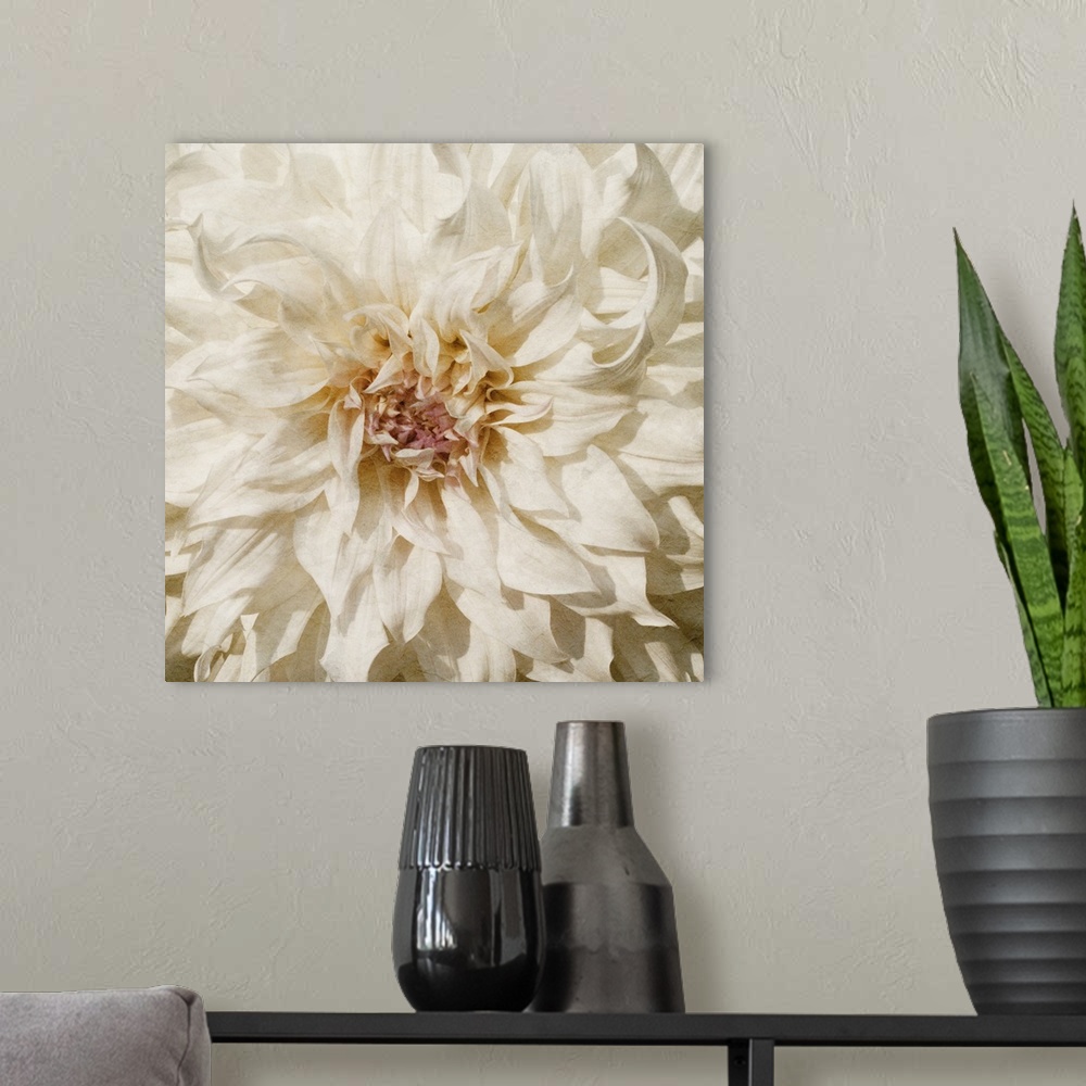 A modern room featuring Flowers in shades of white and yellow fill this decorative art edge to edge.