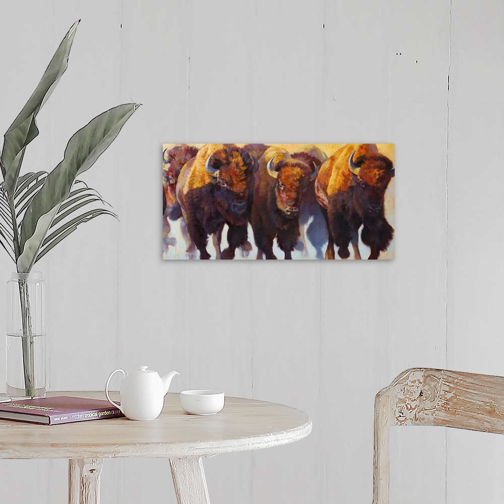 A farmhouse room featuring Painting on canvas of bison and buffalos running in a pack.