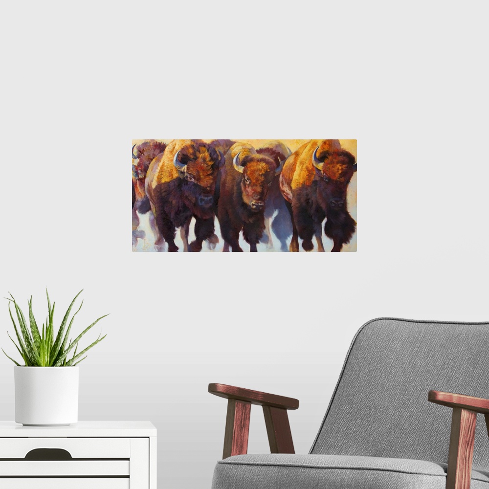 A modern room featuring Painting on canvas of bison and buffalos running in a pack.